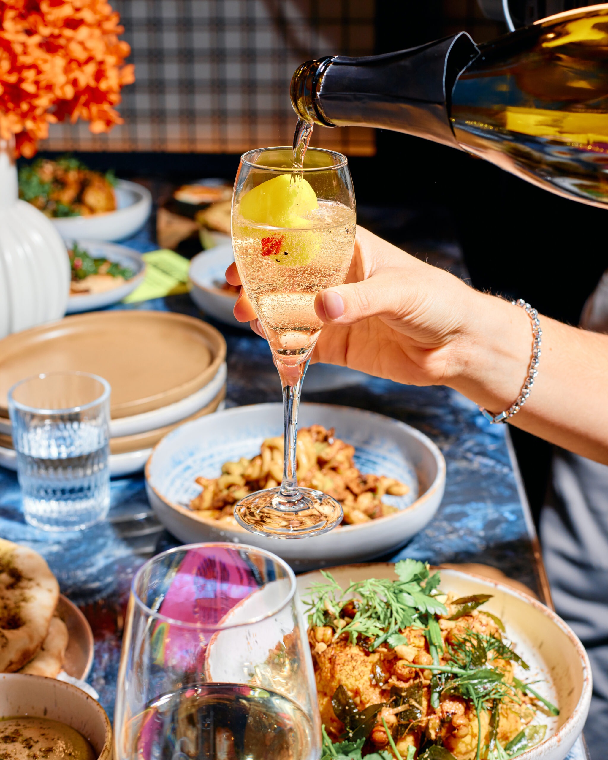 Cocktail and plated food on a table
