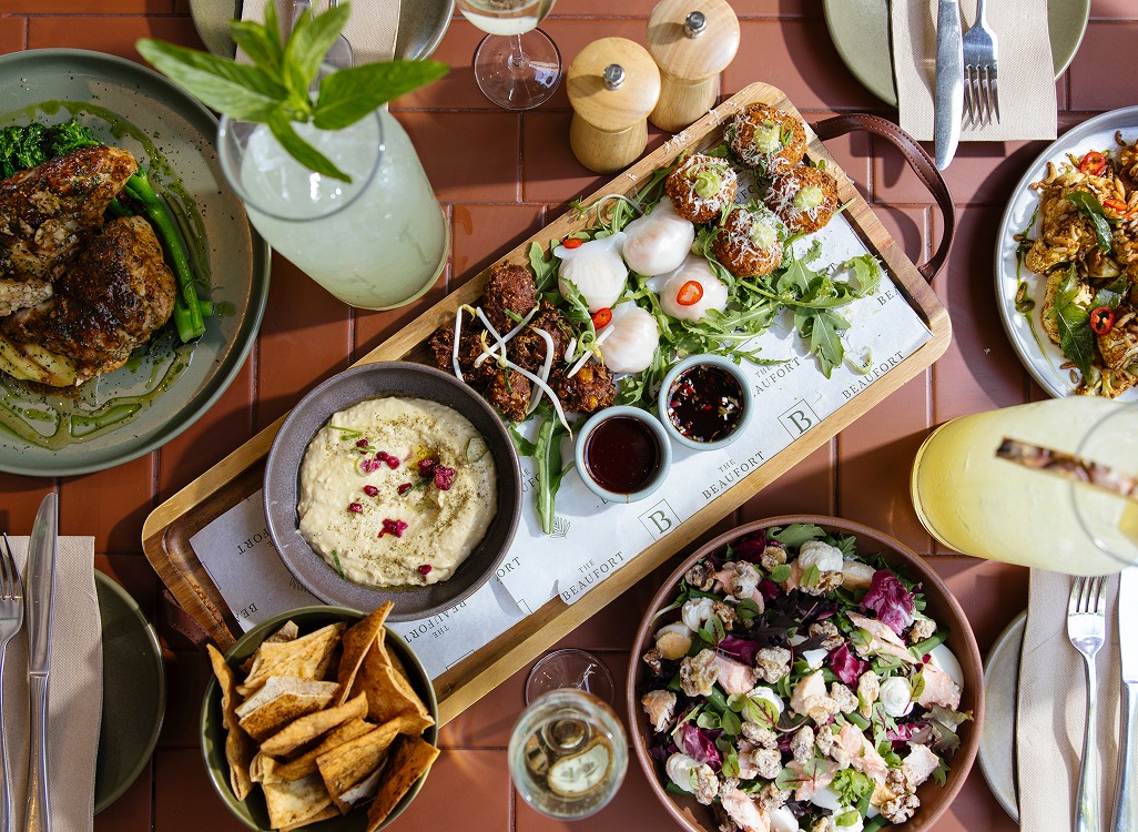 Outdoor brunch setup with croissants, mimosas, and florals at The Beaufort – BottomlessBrunch Perth
